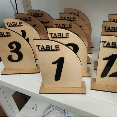 Table numbers for wedding made from plywood and black acrylic.